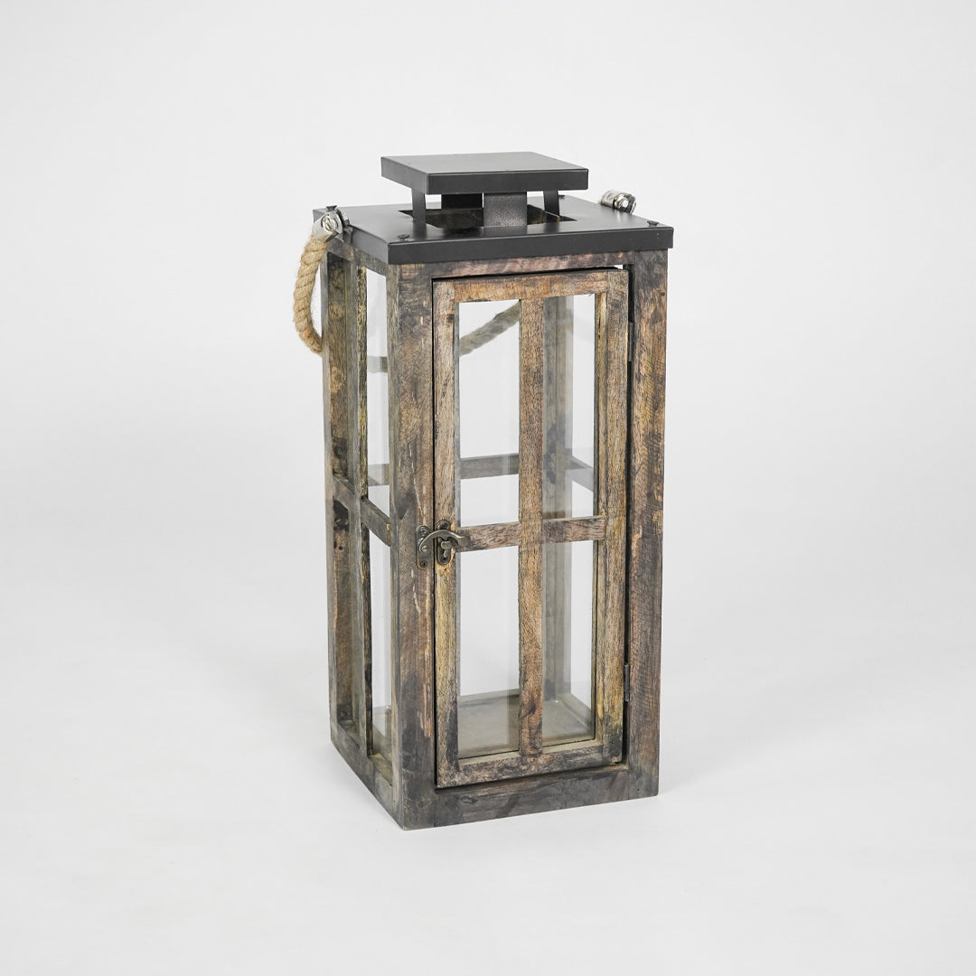 Wooden lantern with glass panels on a white background