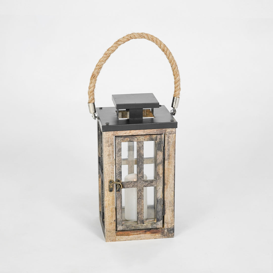 Wooden lantern with a rope handle on a white background