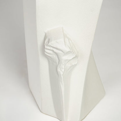 Textured white ceramic tall vase with abstract sculptural details for elegant interior decor styling.