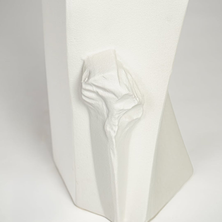 Textured white ceramic tall vase with abstract sculptural details for elegant interior decor styling.