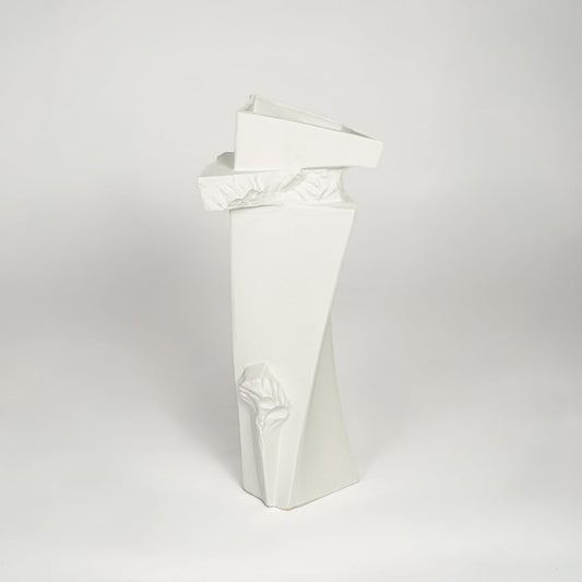 Contemporary white ceramic tall decor vase with textured accents for minimalist living room styling.