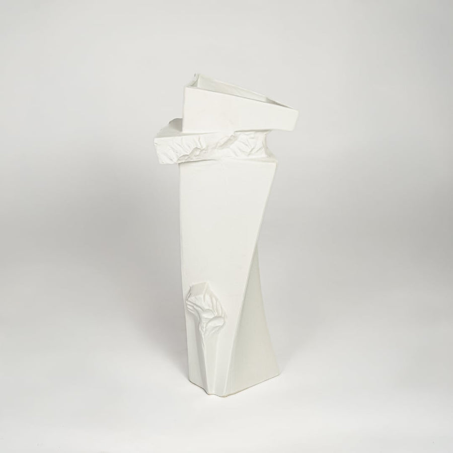 Contemporary white ceramic tall decor vase with textured accents for minimalist living room styling.