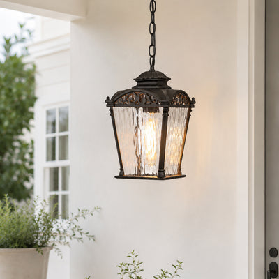 Vintage black metal outdoor hanging lantern for porch entrance balcony and covered patio with warm ambient lighting.