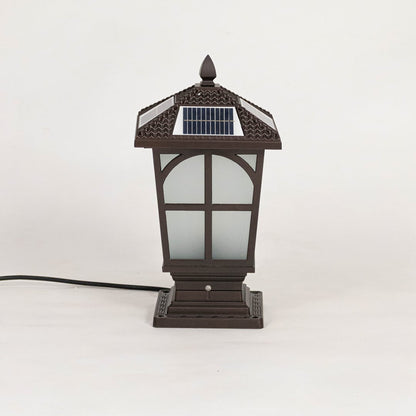 Classic brown solar pillar light with frosted glass body displayed off on plain white background.