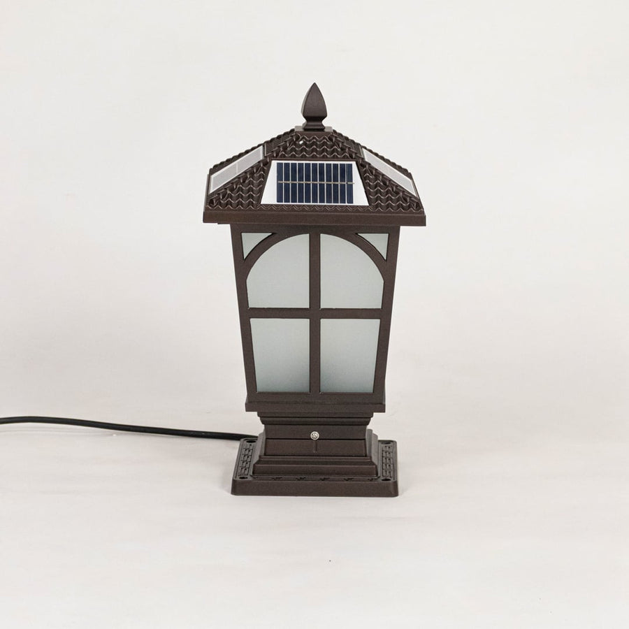 Classic brown solar pillar light with frosted glass body displayed off on plain white background.