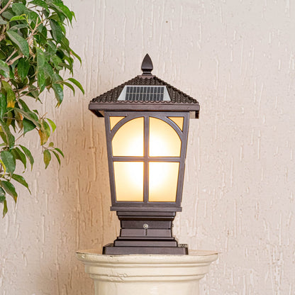 Outdoor solar gate light in black metal with frosted glass displayed on white background highlighting classic exterior lighting design.