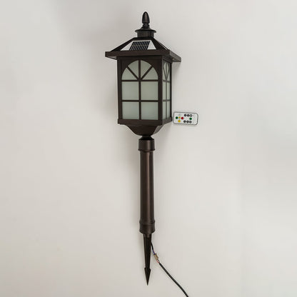 A bronze solar pathway lantern with the light off displayed on a white background emphasizing its tall stake structure frosted panels and decorative classic top.