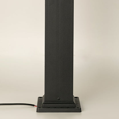 A closeup highlighting the lower section of the outdoor pillar lamp showing the tall rectangular post base plate construction and smooth matte black finish.