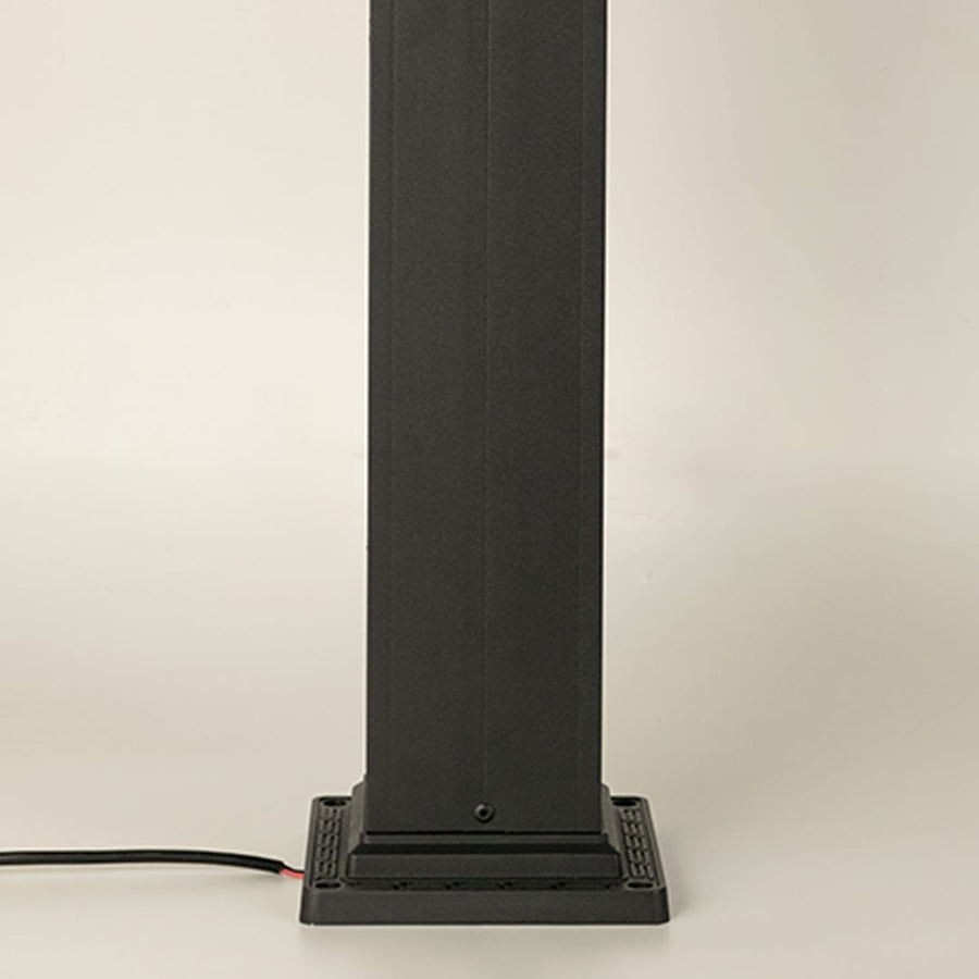 A closeup highlighting the lower section of the outdoor pillar lamp showing the tall rectangular post base plate construction and smooth matte black finish.
