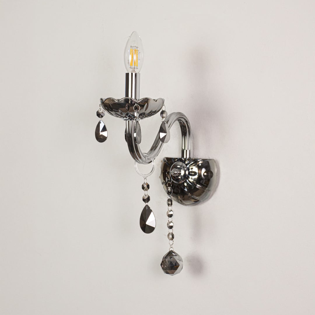 Wall light with chrome metal frame and dark crystal accents displayed on a white background for clear refined product detail.