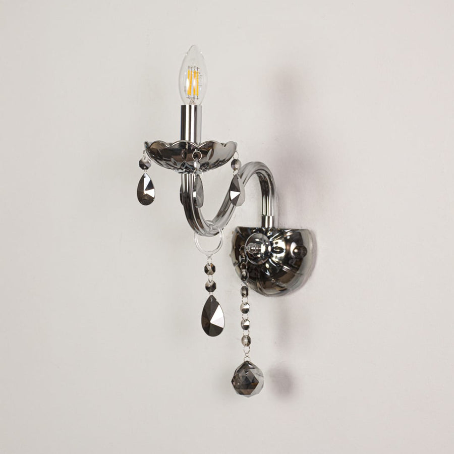 Wall light with chrome metal frame and dark crystal accents displayed on a white background for clear refined product detail.