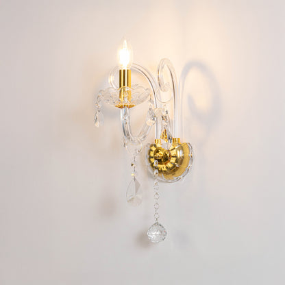 Modern crystal wall light in gold finish with hanging crystals for bedroom or living decor lighting white background.