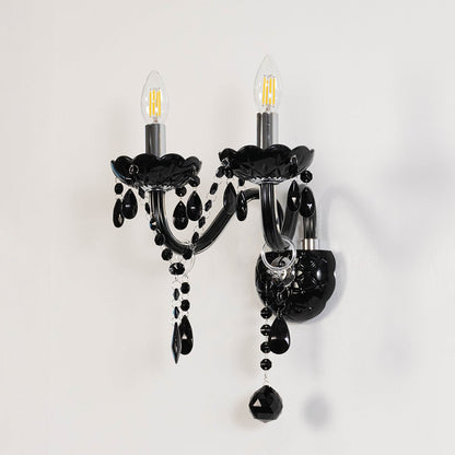 Black wall light with crystal drops stylish dual candle wall mounted decorative fixture on off white background.