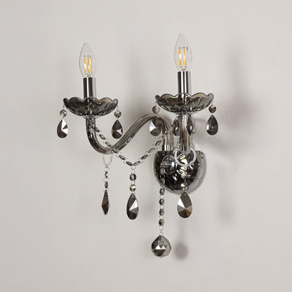 Wall light with chrome metal frame and dark crystal accents displayed on a white background for clear refined product detail.