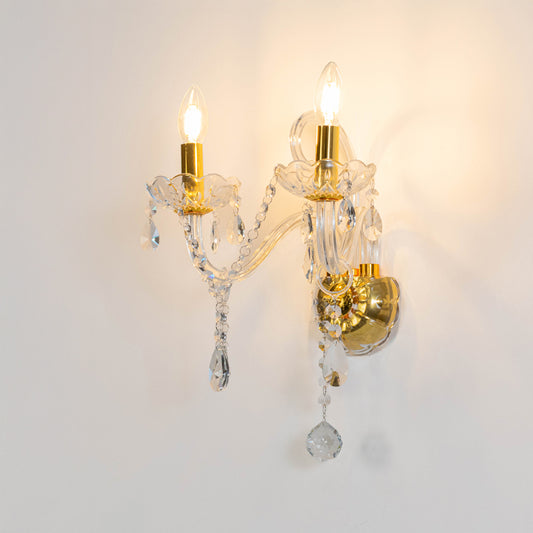 Elegant crystal wall light in gold finish with hanging crystals for bedroom or living room decor lighting white background.