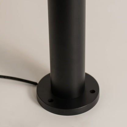 A detailed closeup focused on the upper section of the bollard light showing the metal cap transparent glass edges and inner bulb socket structure for product clarity.