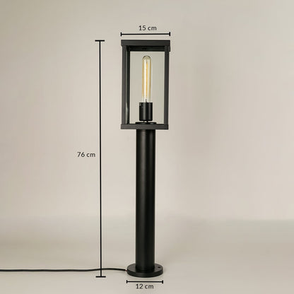 A black outdoor bollard light on a white background with dimensions marked showing 76 cm total height 15 cm top width and 12 cm base width providing precise size reference.