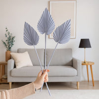 Light purple dried palm leaves styled in modern living room for boho home decor and vase decoration.