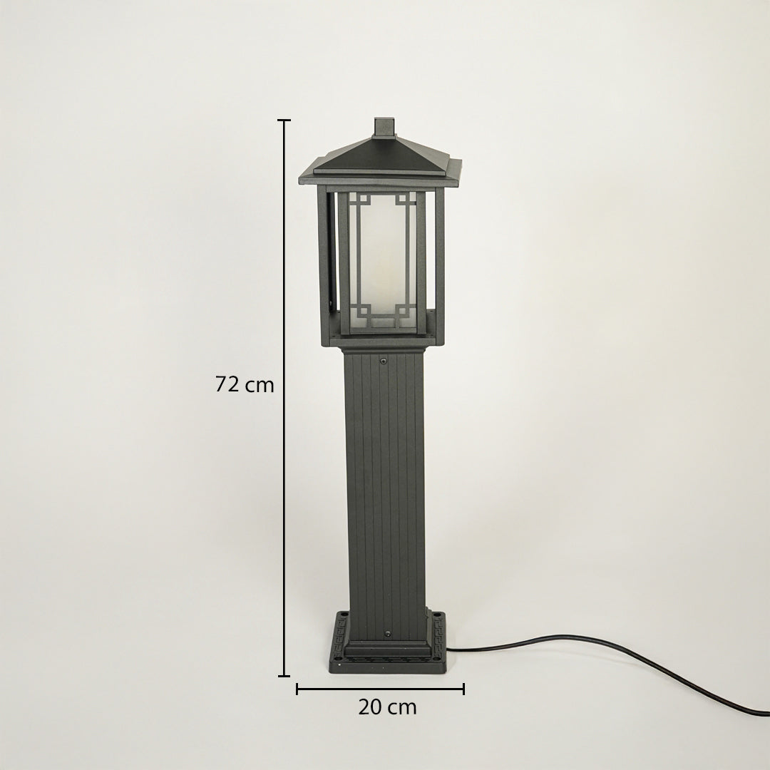 Classic outdoor pillar light with black metal body and framed glass enclosure on neutral background 72 cm height 20 cm width ideal for gate or garden lighting.