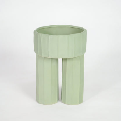 Green ceramic planter pot for elegant console table placement and contemporary indoor home decor styling accent.