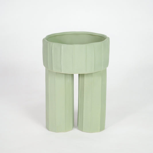 Green ceramic planter pot for elegant console table placement and contemporary indoor home decor styling accent.