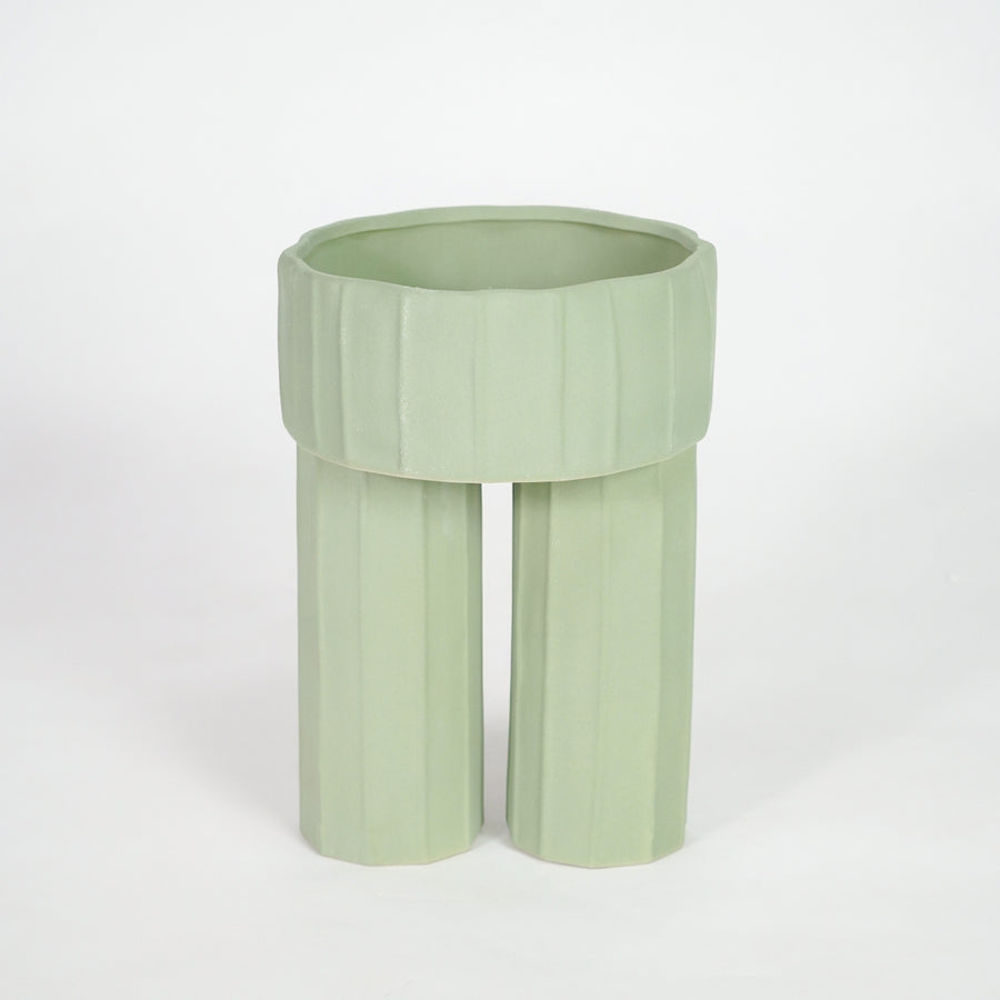 Green ceramic planter pot for elegant console table placement and contemporary indoor home decor styling accent.