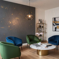 Smoked glass pendant light with metal finish illuminating modern living room decor above elegant coffee table.