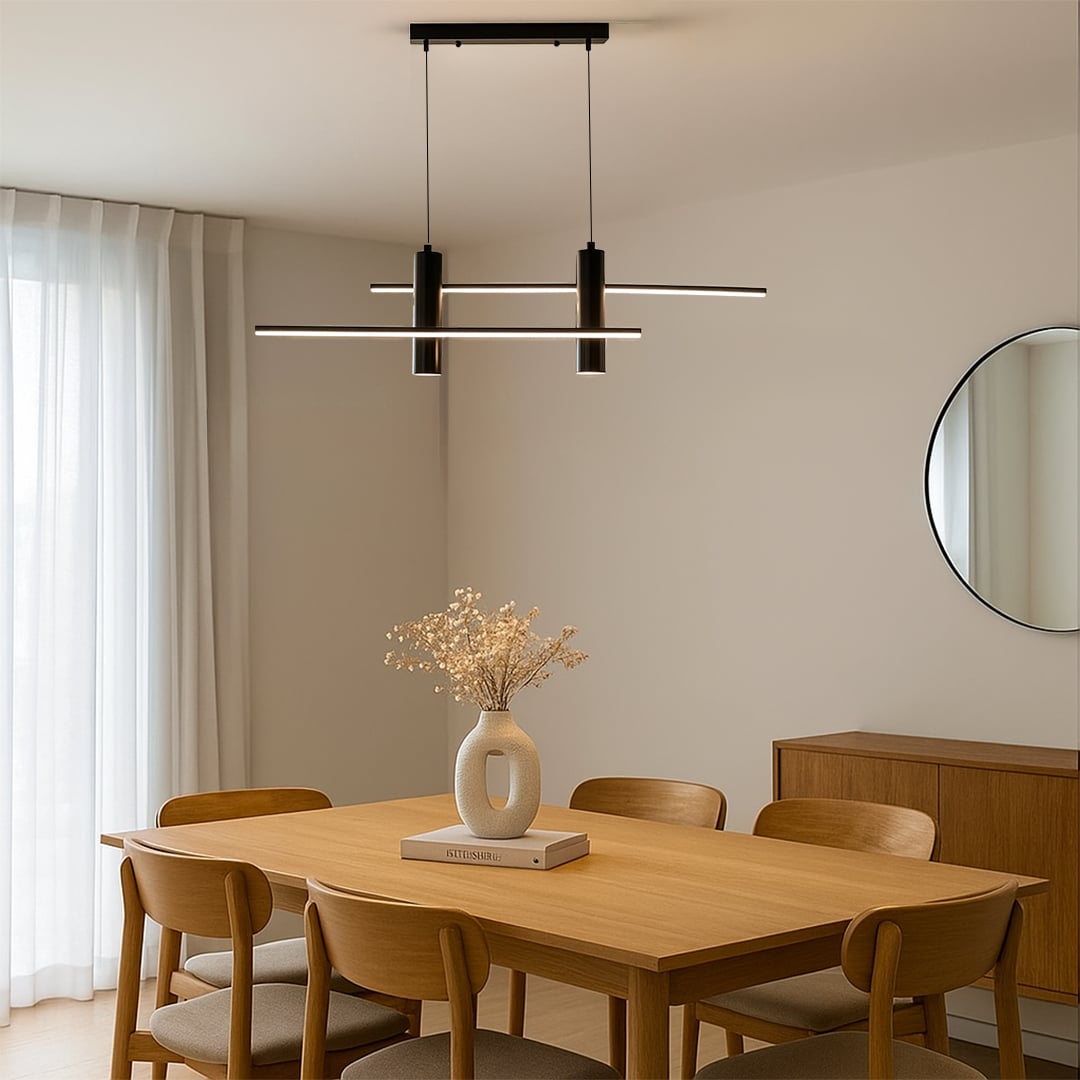 Black sculptural pendant chandelier with curved LED bars hanging above a dining area creating a modern artistic focal element that enhances the clean interior setting.