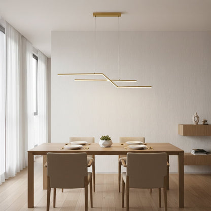 Gold metal linear pendant light styled above dining area creating sleek modern ceiling lighting for contemporary home interiors.
