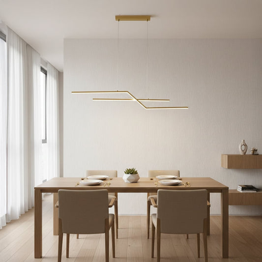 Gold metal linear pendant light styled above dining area creating sleek modern ceiling lighting for contemporary home interiors.