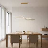 Gold metal linear pendant light styled above dining area creating sleek modern ceiling lighting for contemporary home interiors.