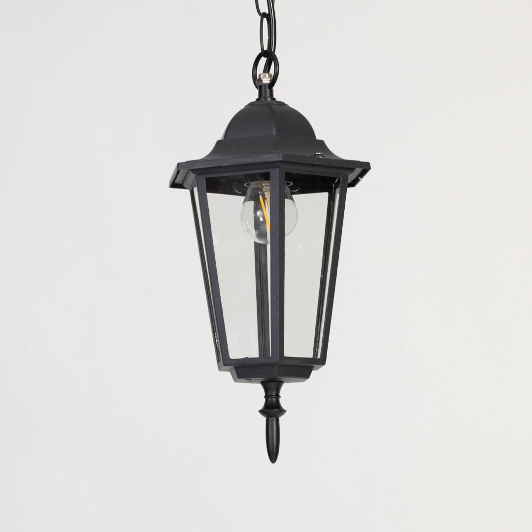 Contemporary black metal hanging lantern light with clear glass panels for stylish outdoor lighting decor.