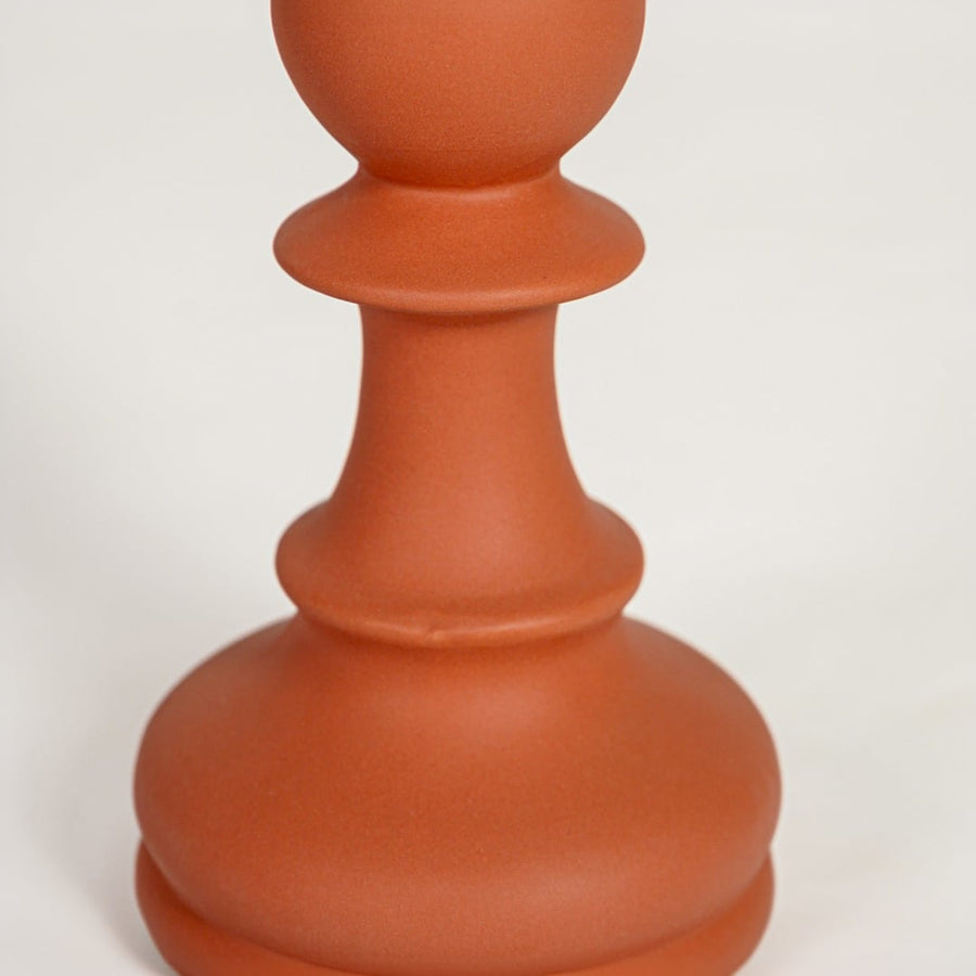 Detailed view of terracotta ceramic flower vase with stacked sculptural form perfect for contemporary entryway decor display.