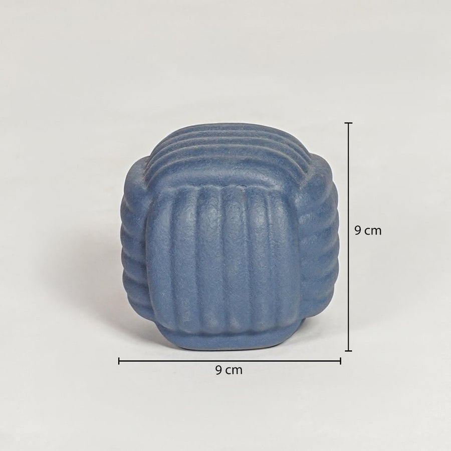 Blue pebble ceramic decorative object measuring 9 cm height and 9 cm width ideal for modern shelf decor styling.