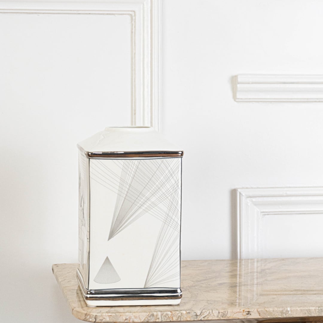 White ceramic jar with silver geometric line detailing perfect for modern home décor and clean minimalist styling.