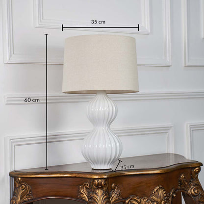 White ceramic table lamp with dimension markings showing 60 cm height and 35 cm width ideal for bedside tables consoles or living room sideboards.