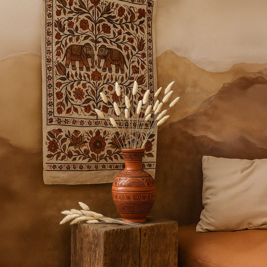 Beige lagurus bunny tail grass bouquet styled in terracotta vase lifestyle ethnic home decor background display.