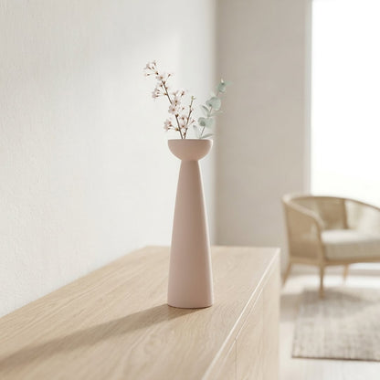 Pink ceramic tall flower vase placed on console table modern decorative vase for living room corner home decor styling.