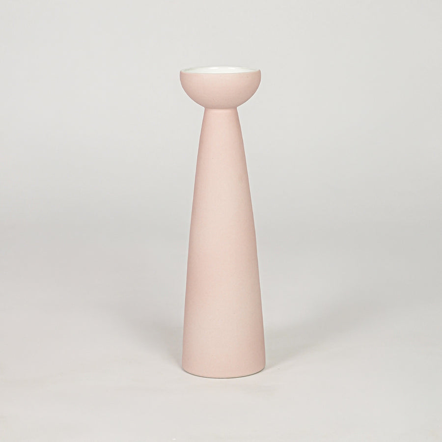 Slender matte pastel pink pedestal vase for chic modern home decor and refined elegant tabletop styling accents.
