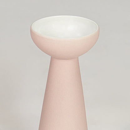 Pink ceramic flower vase closeup modern decorative tabletop vase for living room shelf console decor styling.