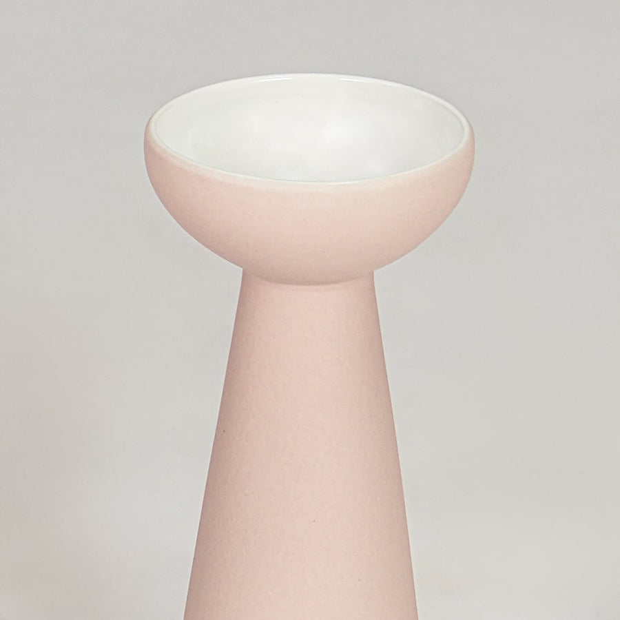 Pink ceramic flower vase closeup modern decorative tabletop vase for living room shelf console decor styling.