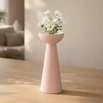 Pink ceramic flower vase with flowers placed on table modern decorative vase for living room interior decor styling.