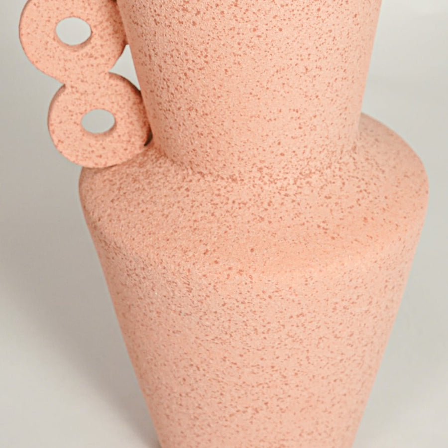 Close up view peach decorative ceramic vase showing unique side handle design textured finish accent for shelf styling home.