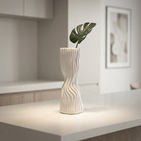 White ceramic flower vase with wavy textured design for elegant tabletop and modern home decor styling ideas.