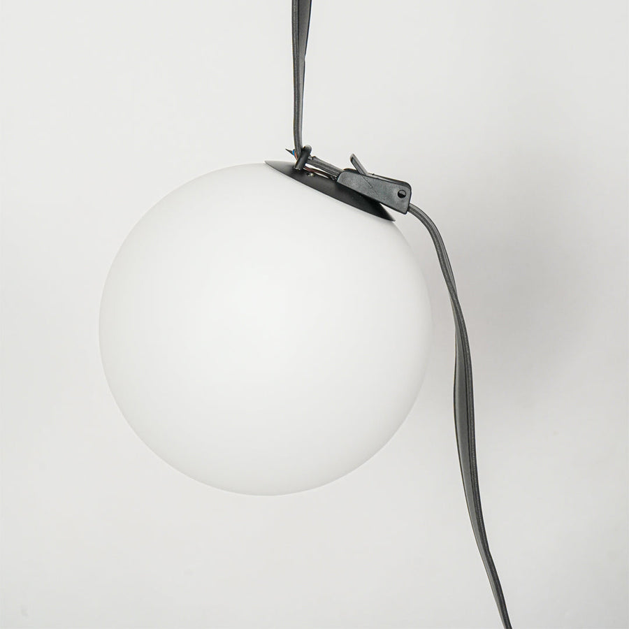 Detailed view of white globe glass pendant light showcasing premium finish and modern styling.