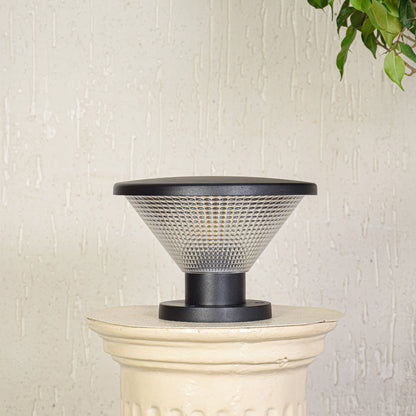 Modern outdoor pillar light with conical textured glass shade installed on exterior wall creating soft ambient lighting for outdoor decor.