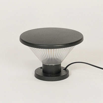 Minimal outdoor pillar light with black metal frame and glass diffuser on clean background perfect for contemporary landscape lighting.