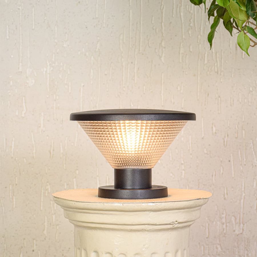 Contemporary outdoor pillar light with glowing textured glass shade mounted on exterior wall ideal for modern garden lighting.

