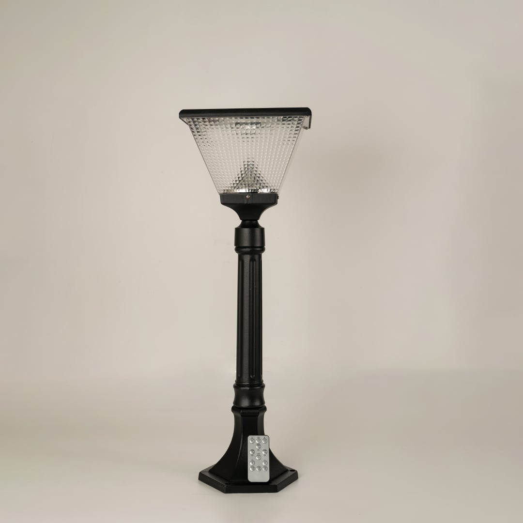 Black solar outdoor street light with textured glass panels for stylish exterior decor use.