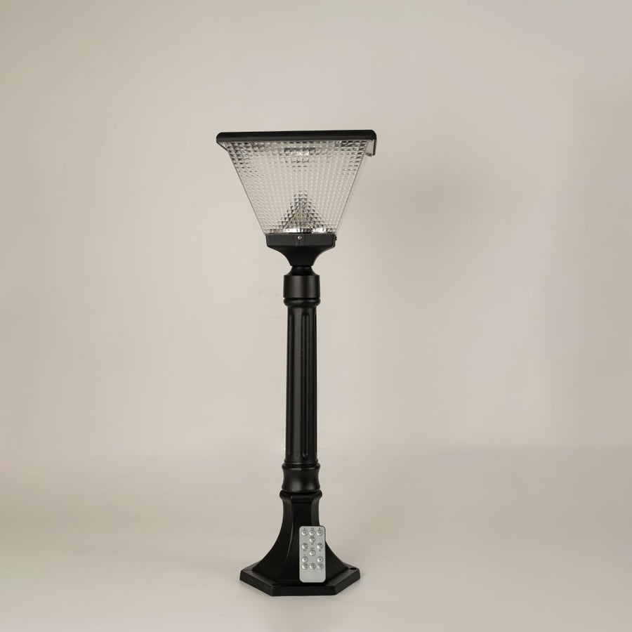 Black solar outdoor street light with textured glass panels for stylish exterior decor use.